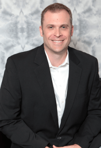 Dr. Noble Smiling for a Portrait